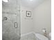 Modern bathroom with glass shower and tiled walls at 4825 Gulf Of Mexico Dr # 105, Longboat Key, FL 34228
