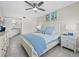Bedroom with ensuite bathroom and white furnishings at 4825 Gulf Of Mexico Dr # 105, Longboat Key, FL 34228