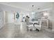 Charming dining area with a round table and wicker chairs at 4825 Gulf Of Mexico Dr # 105, Longboat Key, FL 34228