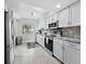 Modern kitchen with stainless steel appliances and granite countertops at 4825 Gulf Of Mexico Dr # 105, Longboat Key, FL 34228