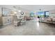 Bright living room with tiled floors, comfy seating, and ocean views at 4825 Gulf Of Mexico Dr # 105, Longboat Key, FL 34228
