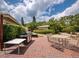 Outdoor patio with grill and seating at 4825 Gulf Of Mexico Dr # 105, Longboat Key, FL 34228