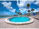 Relaxing beachfront pool with lounge chairs and ocean views at 4825 Gulf Of Mexico Dr # 105, Longboat Key, FL 34228