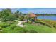 Lakeside gazebo with walking path and lush landscaping in a tranquil community at 5732 Puccini St, Nokomis, FL 34275