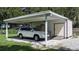 White carport with attached storage shed at 708 61St E St, Palmetto, FL 34221