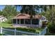 House exterior showcasing a red roof and mature landscaping at 708 61St E St, Palmetto, FL 34221