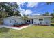 Newly built home with landscaped front yard and attached garage at 3800 Davis Blvd, Sarasota, FL 34232