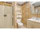 Small bathroom with shower, toilet and vanity at 4931 Oxford Dr, Sarasota, FL 34242