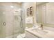 Modern bathroom with a glass shower, marble tile, and updated vanity at 4931 Oxford Dr, Sarasota, FL 34242