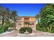 Two-story house with a light peach exterior, two-car garage, and landscaping at 4931 Oxford Dr, Sarasota, FL 34242