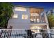 Two-story house with screened balcony, pool, and lush landscaping at 4931 Oxford Dr, Sarasota, FL 34242