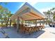 Modern picnic pavilion with multiple wooden tables at 4931 Oxford Dr, Sarasota, FL 34242