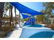 Playground with blue shade structure and play equipment at 4931 Oxford Dr, Sarasota, FL 34242