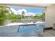 Inviting pool area with patio furniture and canal views at 4931 Oxford Dr, Sarasota, FL 34242