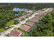 Aerial view of residential neighborhood with lake at 7291 Great Egret Blvd, Sarasota, FL 34241