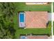 Bird's eye view of home with pool and tile roof at 7291 Great Egret Blvd, Sarasota, FL 34241