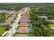 Aerial view of community with houses and a lake at 7291 Great Egret Blvd, Sarasota, FL 34241