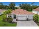 Two-car garage, paver driveway, and tile roof at 7291 Great Egret Blvd, Sarasota, FL 34241