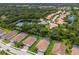 Community overview featuring various homes and lush landscape at 7291 Great Egret Blvd, Sarasota, FL 34241