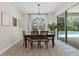 Dining room with chandelier and view of pool at 7291 Great Egret Blvd, Sarasota, FL 34241