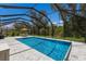 Inviting pool area with covered patio and lush landscaping at 7291 Great Egret Blvd, Sarasota, FL 34241