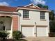 Two-story house with two-car garage, red tile roof and landscaped entry at 7618 Marsh Orchid Cir # 7618, Bradenton, FL 34203