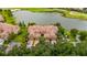 Beautiful aerial view of a waterfront home, showcasing the tile roof and landscaping at 8106 Miramar Way, Lakewood Ranch, FL 34202