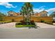 Tan three-unit building with paved driveways at 8106 Miramar Way, Lakewood Ranch, FL 34202