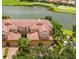 Beautiful exterior elevation of a home with a tile roof and a waterfront view at 8106 Miramar Way, Lakewood Ranch, FL 34202