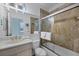 Bathroom with tub shower and updated vanity at 1900 Gulf N Dr # 4, Bradenton Beach, FL 34217