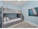 Bedroom with bunk beds and coastal decor at 1900 Gulf N Dr # 4, Bradenton Beach, FL 34217