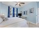 Spacious bedroom with king-size bed and light blue walls at 1900 Gulf N Dr # 4, Bradenton Beach, FL 34217