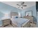 Guest bedroom with full-size bed and ceiling fan at 1900 Gulf N Dr # 4, Bradenton Beach, FL 34217