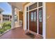 Exterior entryway with a brown door and welcome mat at 1900 Gulf N Dr # 4, Bradenton Beach, FL 34217