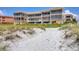 Building's rear view, showing beach access at 1900 Gulf N Dr # 4, Bradenton Beach, FL 34217