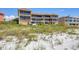 Building's rear view, beach access at 1900 Gulf N Dr # 4, Bradenton Beach, FL 34217