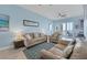 Living room with light blue walls and ocean view at 1900 Gulf N Dr # 4, Bradenton Beach, FL 34217