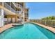 Inviting community pool and spa area at 1900 Gulf N Dr # 4, Bradenton Beach, FL 34217