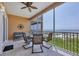 Oceanfront balcony with seating for four at 1900 Gulf N Dr # 4, Bradenton Beach, FL 34217