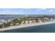 Aerial view of beachfront community, showcasing homes and landscaping at 2810 N Beach Rd # 106, Englewood, FL 34223