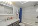 Clean bathroom with marble vanity and a bathtub at 2810 N Beach Rd # 106, Englewood, FL 34223