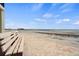 Relaxing beach view with a bench overlooking the ocean at 2810 N Beach Rd # 106, Englewood, FL 34223