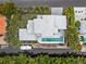 Bird's-eye view of a modern home with private pool and dock access at 705 Jungle Queen Way, Longboat Key, FL 34228