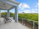 Private balcony with multiple lounge chairs, offering scenic views at 705 Jungle Queen Way, Longboat Key, FL 34228