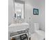 Stylish bathroom with a modern vanity and toilet at 705 Jungle Queen Way, Longboat Key, FL 34228