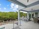 Spacious patio, outdoor furniture, and scenic waterway views at 705 Jungle Queen Way, Longboat Key, FL 34228