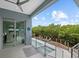 Covered patio with outdoor seating and amazing water views at 705 Jungle Queen Way, Longboat Key, FL 34228