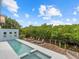 Long, inviting pool with spa and tranquil water views at 705 Jungle Queen Way, Longboat Key, FL 34228