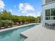 Relaxing pool and spa area with outdoor seating and canal views at 705 Jungle Queen Way, Longboat Key, FL 34228