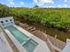 Relaxing pool and spa area overlooking a peaceful waterway at 705 Jungle Queen Way, Longboat Key, FL 34228